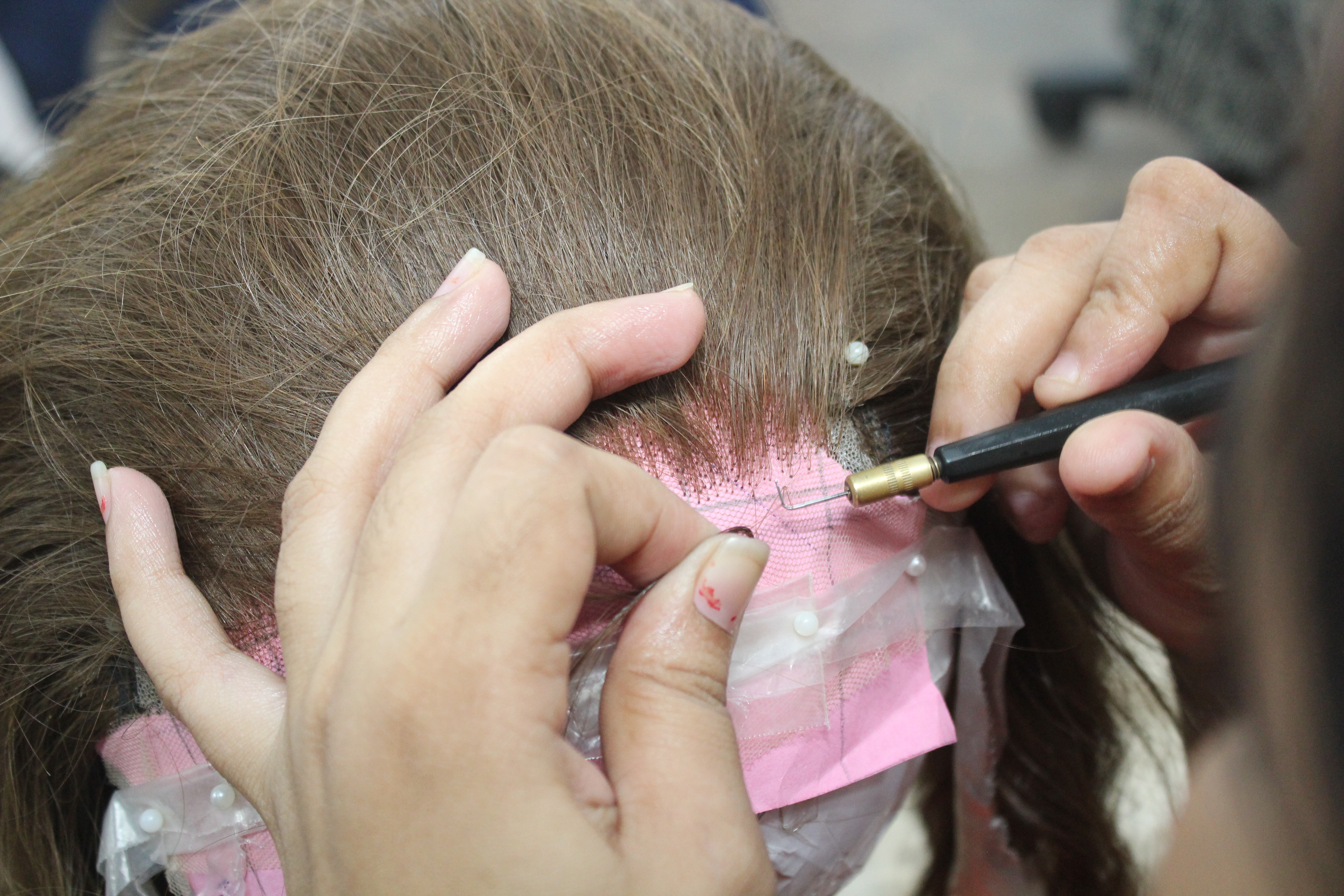 Woman making Wigs - Now